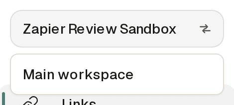 The workspace switcher at the top of the dashboard sidebar: the current workspace name acts as the trigger, and the open menu below lists the other workspaces available to switch to